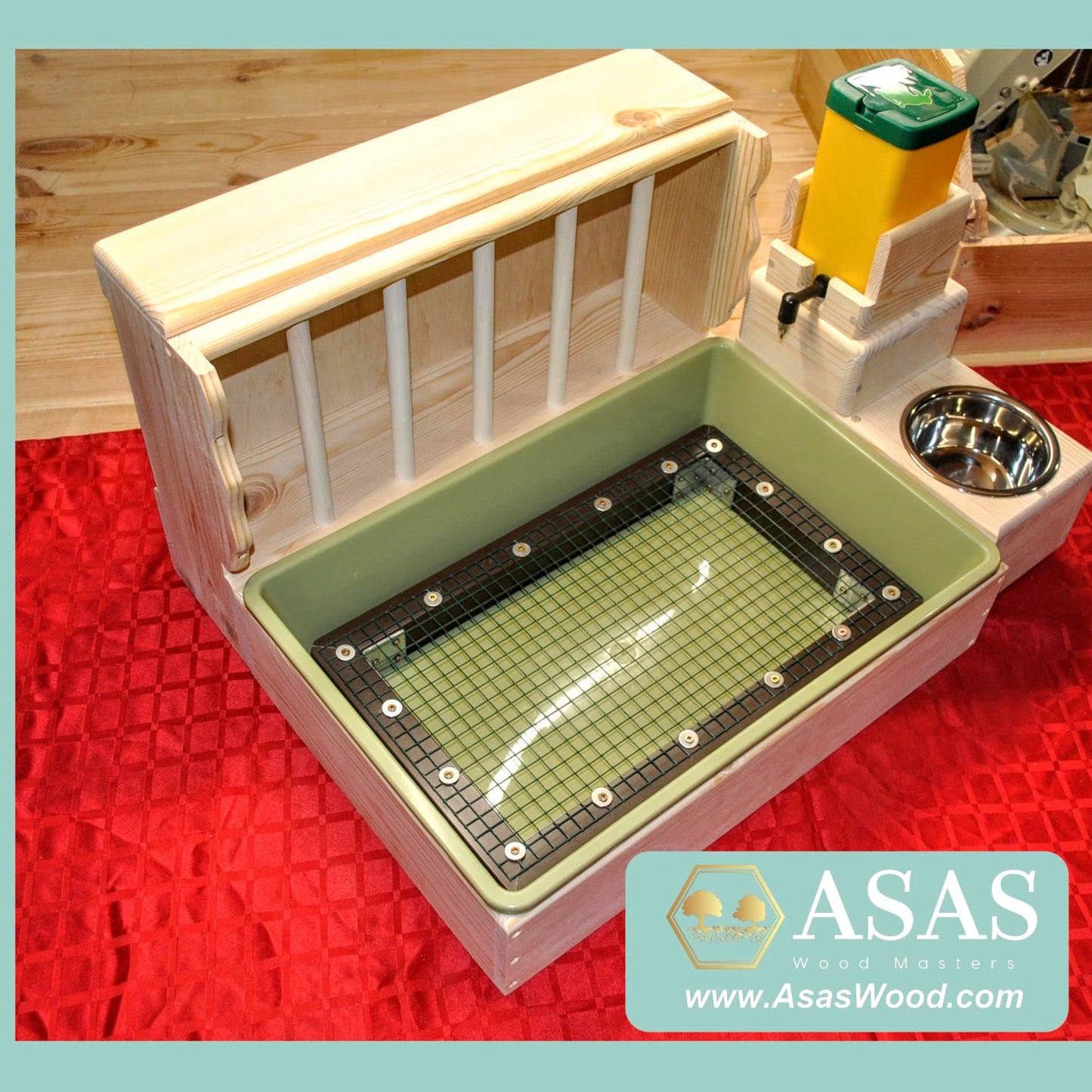 rabbit hay feeder with litter box and food bowl and nipple water bottle station, large size. Litter box has a wire mesh grate insert, green litter pan