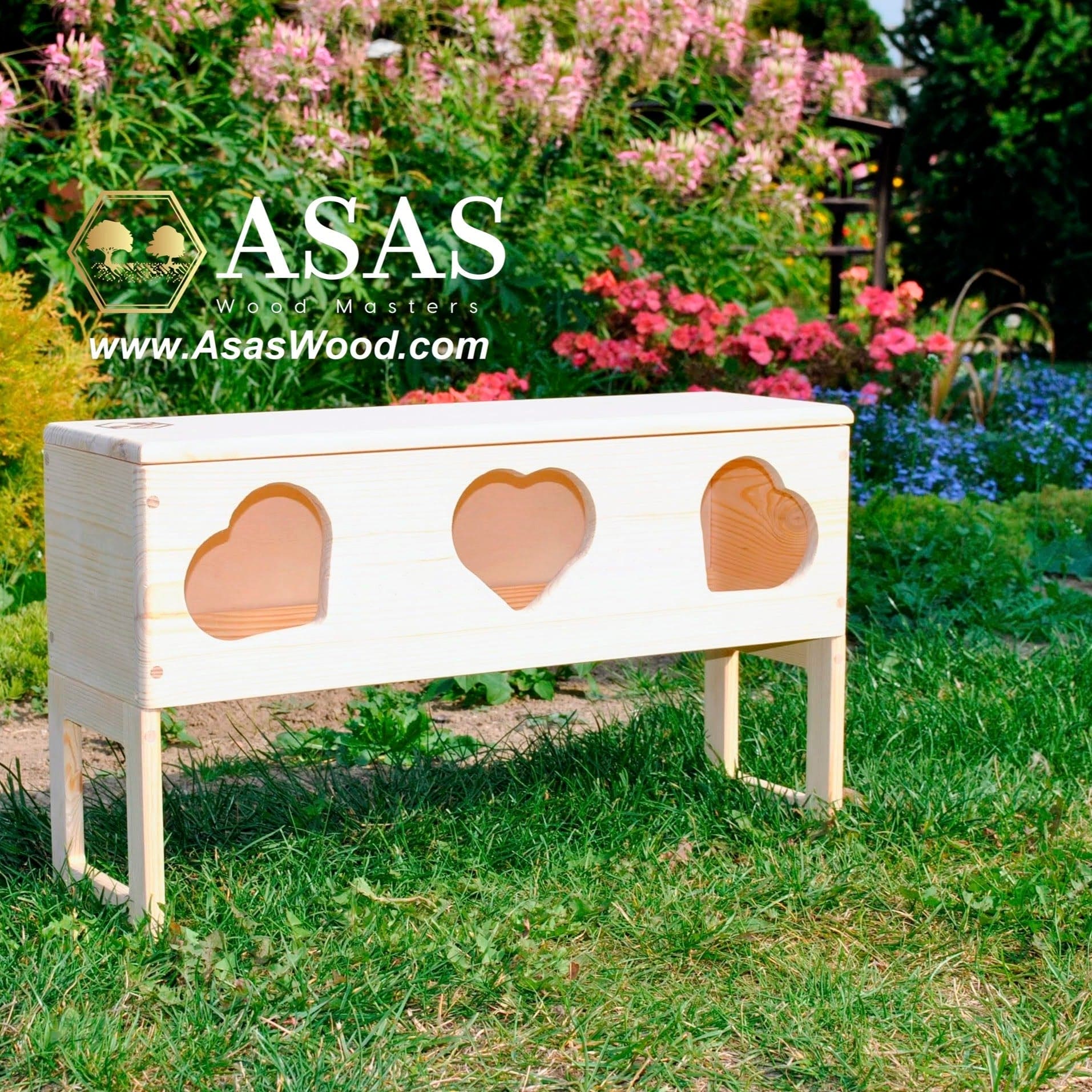rabbit hay feeder with heart shape holes, slide over the litter pan. Flowers and green grass around it